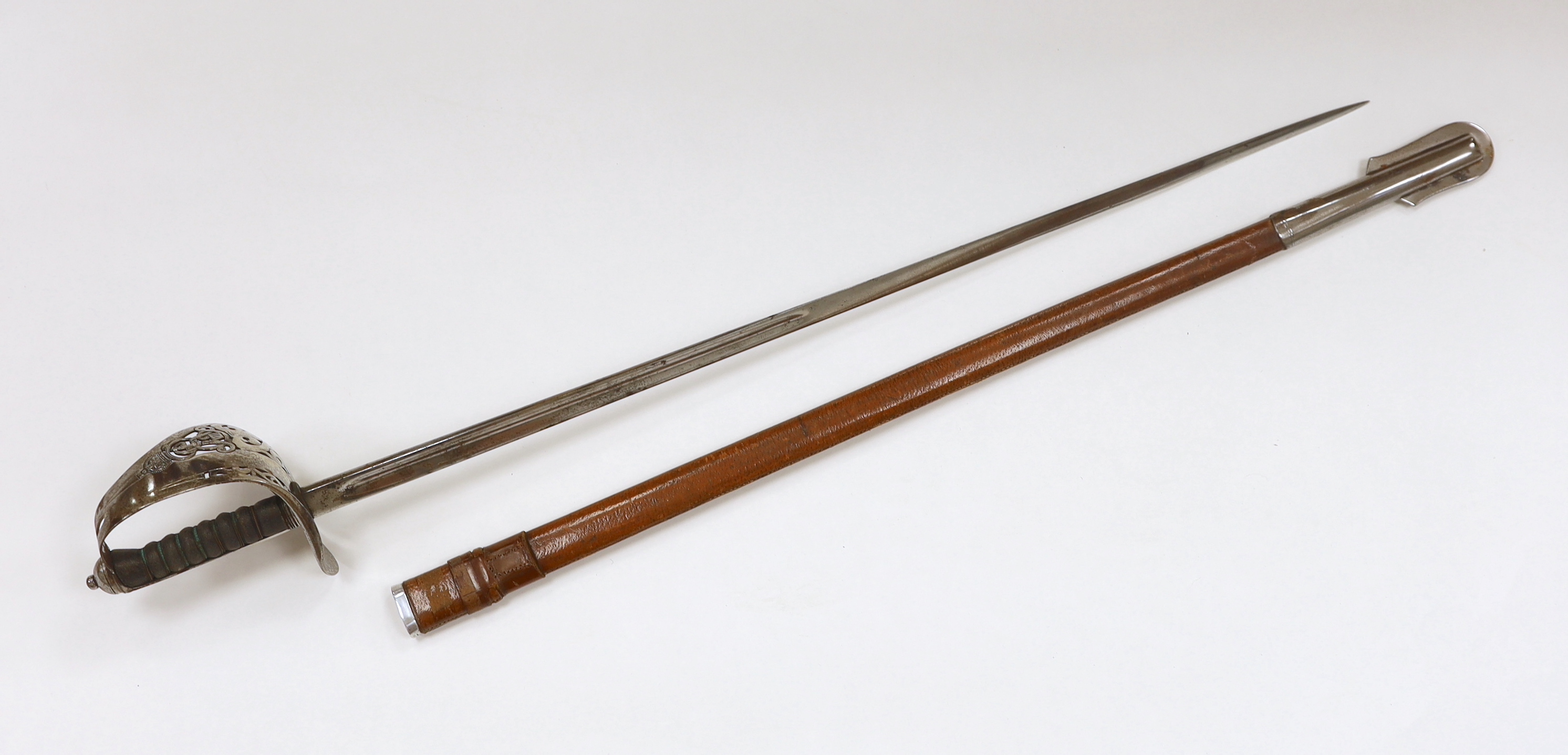 An Edward VII infantry officer's sword in leather scabbard, blade 85cm